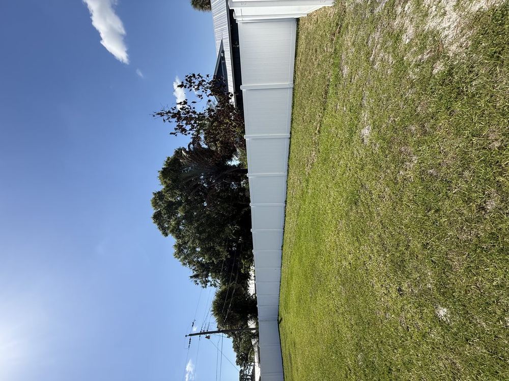 New white vinyl privacy fence install