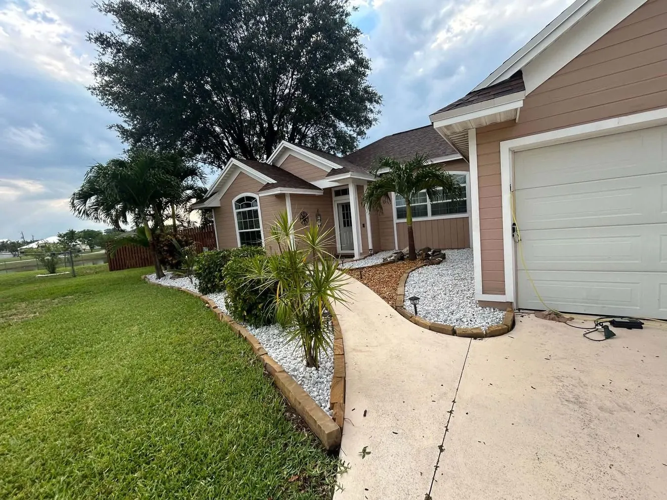 Paver walkway with white rock landscaping